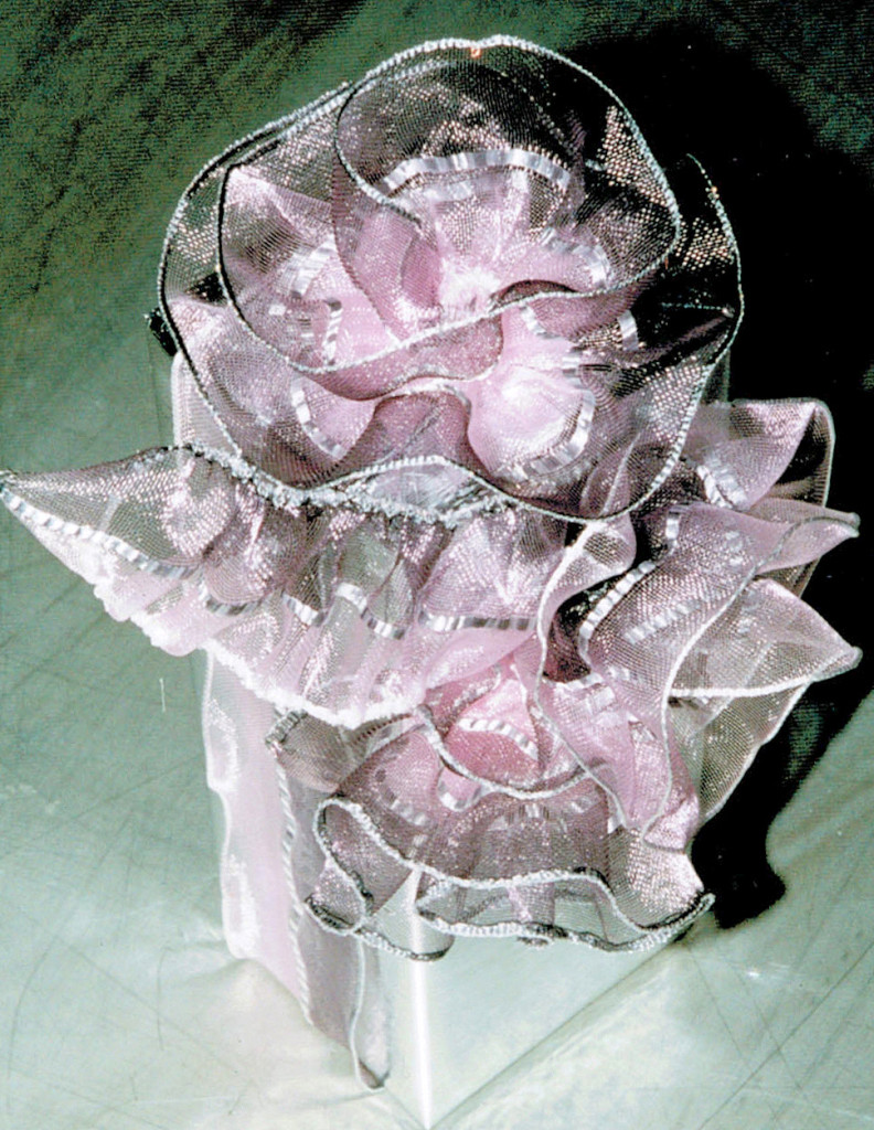 2.version of box covered in silver foil, silver-violet shaded, pushed ribbon, partly formed as rosettes